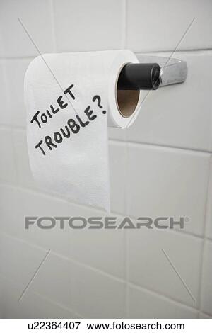 Stock Photo - Close-up of text written on tissue paper in bathroom depicting toilet problems. Fotosearch