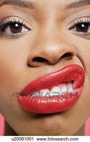 Close-up portrait of young woman with red lips grimacing View Large Photo Image Stock Image - Close-up portrait of young woman with red lips grimacing. Fotosearch