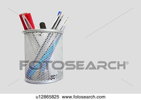 Stock Photography - Close-up view of a pen holder over white background. Fotosearch