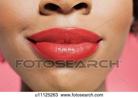 Close-up view of an African American woman's red lips over colored background View Large Photo Image Stock Image - Close-up view of an African American woman's red lips over colored background. Fotosearch