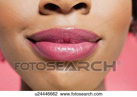 Close-up view of an African American woman's lips over colored background View Large Photo Image Stock Image - Close-up view of an African American woman's lips over colored background. Fotosearch