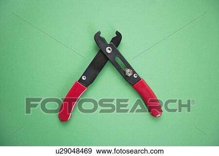 Close-up view of duckbill pliers over green background View Large Photo Image Stock Photo - Close-up view of duckbill pliers over green background. Fotosearch