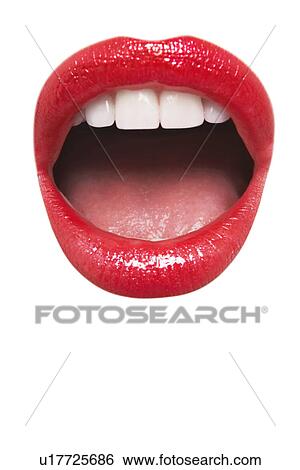 Stock Photograph - Close-up view of female wearing red lipstick with mouth open over white background. Fotosearch