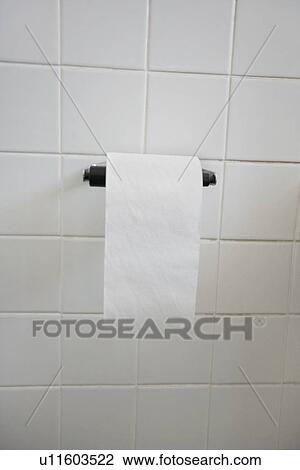 Stock Image - Close-up view of toilet paper in bathroom. Fotosearch