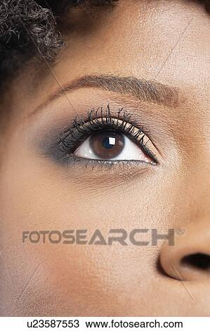 Cropped image of African American woman with eye makeup View Large Photo Image Stock Image - Cropped image of African American woman with eye makeup. Fotosearch