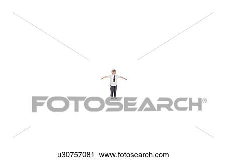 Elementary boy standing at distance with arms outstretched over white background View Large Photo Image Stock Image - Elementary boy standing at distance with arms outstretched over white background. Fotosearch