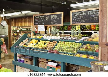 Picture - Fresh fruits stall with text on blackboard in supermarket. Fotosearch