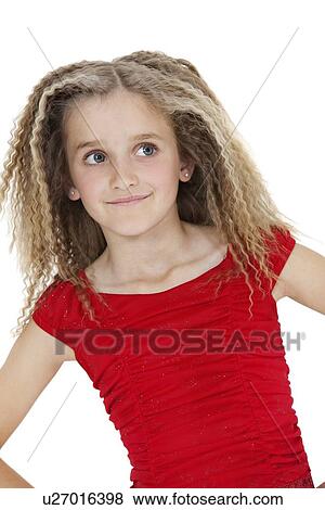 Stock Photo - Front view of smiling girl looking sideways over white background. Fotosearch