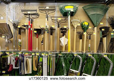 Gardening tools on display in store View Large Photo Image Stock Photography - Gardening tools on display in store. Fotosearch