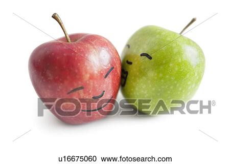 Granny smith apple kissing red apple over white background View Large Photo Image Stock Image - Granny smith apple kissing red apple over white background. Fotosearch