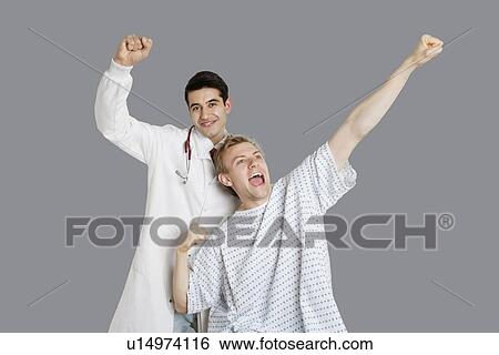 Indian doctor with an enthusiastic patient cheering up View Large Photo Image Stock Photograph - Indian doctor with an enthusiastic patient cheering up. Fotosearch