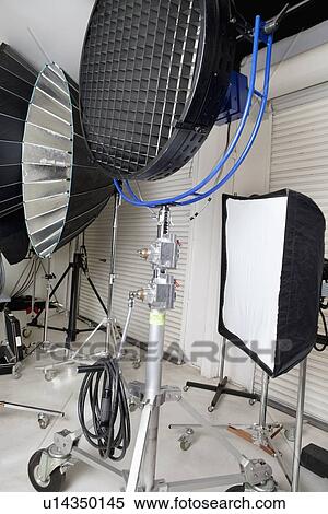 Stock Photography - Photographing lights and reflectors in studio. Fotosearch