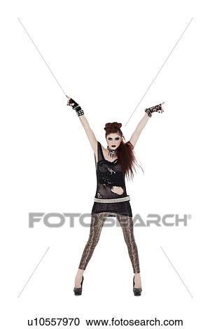 Portrait of a beautiful young woman with arms raised over white background View Large Photo Image Stock Image - Portrait of a beautiful young woman with arms raised over white background. Fotosearch