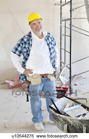 Stock Photography - Portrait of a Caucasian male construction worker smiling. Fotosearch