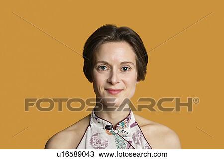 Portrait of a happy mid adult woman over colored background View Large Photo Image Stock Image - Portrait of a happy mid adult woman over colored background. Fotosearch