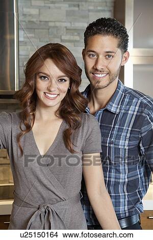 Picture - Portrait of a happy young couple. Fotosearch