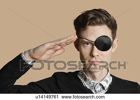 Portrait of a man wearing eye patch saluting over colored background View Large Photo Image Stock Image - Portrait of a man wearing eye patch saluting over colored background. Fotosearch