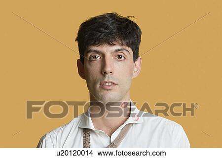 Portrait of a young man with lip print on neck and shirt over colored background View Large Photo Image Picture - Portrait of a young man with lip print on neck and shirt over colored background. Fotosearch