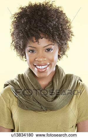 Portrait of an African American woman smiling with a stole round her neck over colored background View Large Photo Image Stock Image - Portrait of an African American woman smiling with a stole round her neck over colored background. Fotosearch