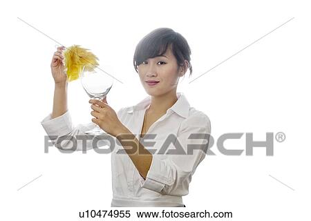 Portrait of Asian woman dusting glass with backlit over white background View Large Photo Image Stock Photography - Portrait of Asian woman dusting glass with backlit over white background. Fotosearch
