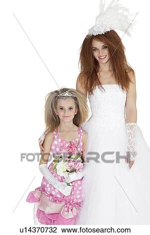 Portrait of beautiful bride and bridesmaid holding flower bouquet over white background View Large Photo Image Stock Image - Portrait of beautiful bride and bridesmaid holding flower bouquet over white background. Fotosearch