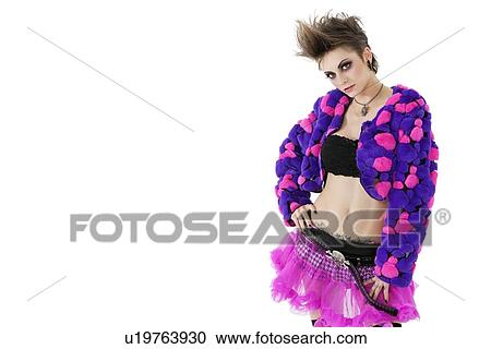 Portrait of beautiful punk woman with hand on hips over white background View Large Photo Image Stock Image - Portrait of beautiful punk woman with hand on hips over white background. Fotosearch