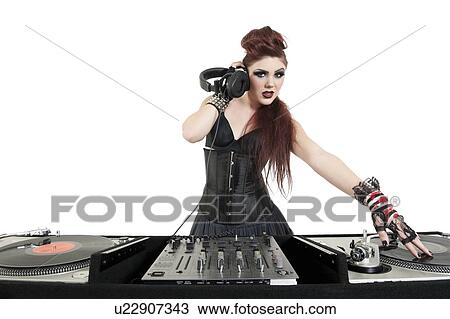 Portrait of beautiful young DJ listening to music over white background View Large Photo Image Stock Image - Portrait of beautiful young DJ listening to music over white background. Fotosearch