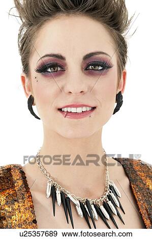 Portrait of beautiful young punk woman over white background View Large Photo Image Stock Photo - Portrait of beautiful young punk woman over white background. Fotosearch