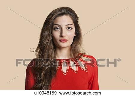 Portrait of beautiful young woman in red over colored background View Large Photo Image Stock Photo - Portrait of beautiful young woman in red over colored background. Fotosearch