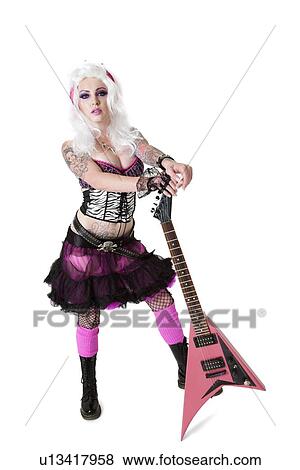 Portrait of beautiful young woman wearing wig standing with guitar over white background View Large Photo Image Stock Photo - Portrait of beautiful young woman wearing wig standing with guitar over white background. Fotosearch