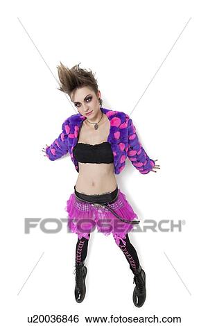 Portrait of beautiful young woman with spiked hair over white background View Large Photo Image Stock Photograph - Portrait of beautiful young woman with spiked hair over white background. Fotosearch