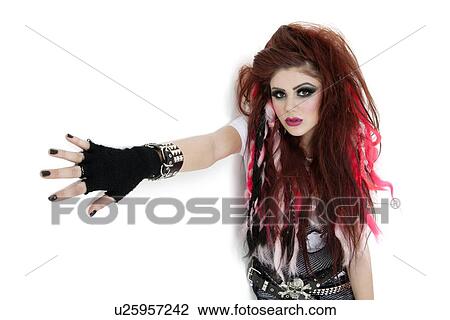 Portrait of funky young woman standing over white background View Large Photo Image Stock Image - Portrait of funky young woman standing over white background. Fotosearch