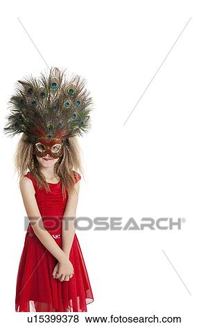 Portrait of girl in red outfit wearing peacock mask over white background View Large Photo Image Stock Photo - Portrait of girl in red outfit wearing peacock mask over white background. Fotosearch