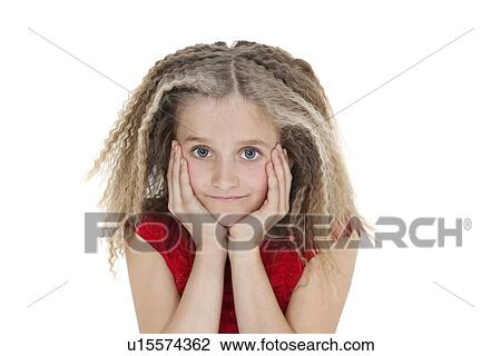 Stock Image - Portrait of girl with head in hands over white background. Fotosearch