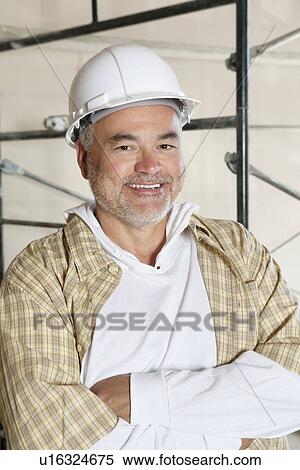 Portrait of happy architect with arms crossed View Large Photo Image Stock Photography - Portrait of happy architect with arms crossed. Fotosearch