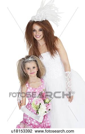 Portrait of happy bride with bridesmaid holding bouquet over white background View Large Photo Image Stock Image - Portrait of happy bride with bridesmaid holding bouquet over white background. Fotosearch