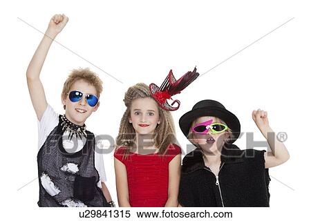 Portrait of kids fancy dress outfit with raised fist over white background View Large Photo Image Stock Photography - Portrait of kids fancy dress outfit with raised fist over white background. Fotosearch