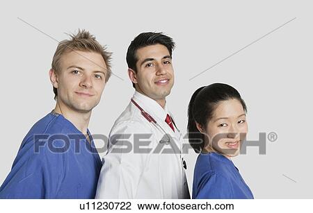 Portrait of multi ethnic medical team over gray background View Large Photo Image Stock Image - Portrait of multi ethnic medical team over gray background. Fotosearch