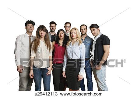 Stock Image - Portrait of multiethnic group of friends standing together over colored background. Fotosearch