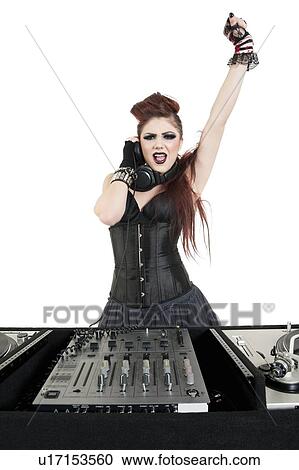 Stock Image - Portrait of punk DJ with arm raised over white background. Fotosearch