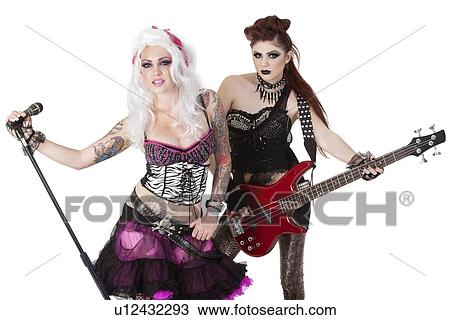 Stock Image - Portrait of punk rock band over white background. Fotosearch
