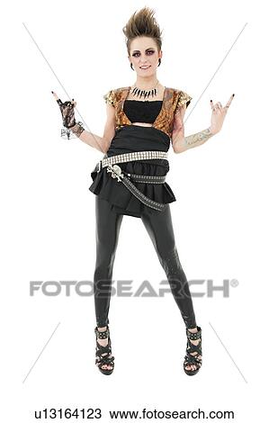 Portrait of punk woman gesturing rock sign over white background View Large Photo Image Stock Image - Portrait of punk woman gesturing rock sign over white background. Fotosearch