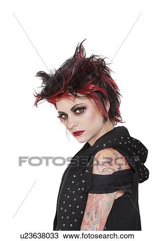 Portrait of punk woman showing attitude over white background View Large Photo Image Stock Image - Portrait of punk woman showing attitude over white background. Fotosearch