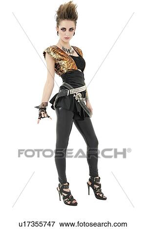 Portrait of punk woman with attitude gesturing rock & roll sign over white background View Large Photo Image Stock Photo - Portrait of punk woman with attitude gesturing rock & roll sign over white background. Fotosearch