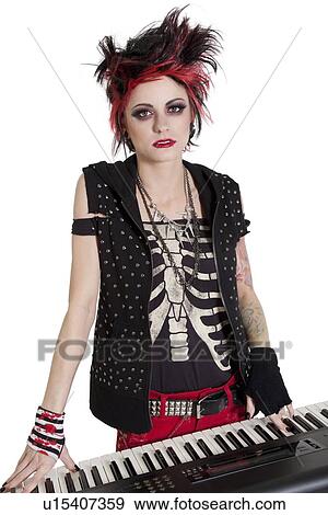 Stock Photo - Portrait of rock woman with spiked hair and piano over white background. Fotosearch