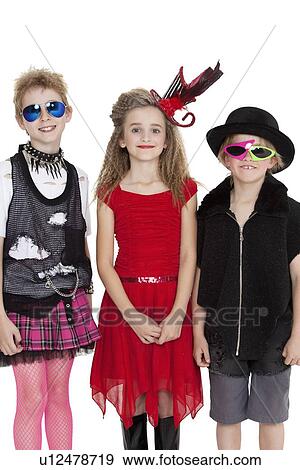 Portrait of school children wearing fancy dress outfits over white background View Large Photo Image Stock Photo - Portrait of school children wearing fancy dress outfits over white background. Fotosearch