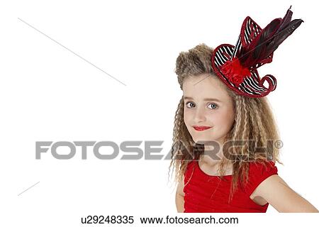 Stock Photography - Portrait of school girl wearing headgear over white background. Fotosearch