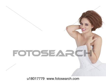 Stock Photo - Portrait of smiling young brunette posing over white background. Fotosearch