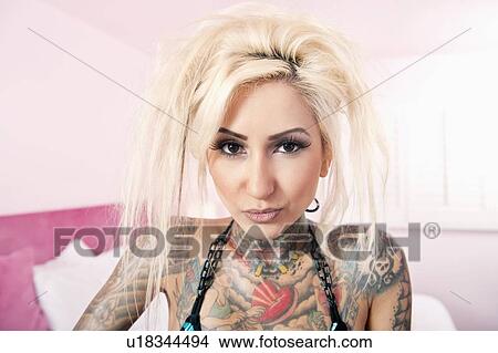Portrait of stylish tattooed woman View Large Photo Image Picture - Portrait of stylish tattooed woman. Fotosearch