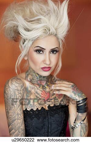 Portrait of stylish tattooed woman View Large Photo Image Stock Image - Portrait of stylish tattooed woman. Fotosearch